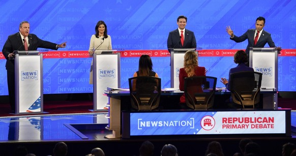 News: Republican Presidential Primary Debate presented by NewsNation Dec 6, 2023 Tuscaloosa, AL, USA Businessperson Vivek Ramaswamy right and former New Jersey Gov. Chris Christie left talk over each  ...