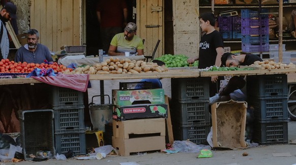 Israel Continues Strikes Across Gaza Street vendors sell vegetables and lit a cigarette in Gaza as the war enters its 14th day. Gaza Strip, October 19, 2023. Food and water are already running low, an ...