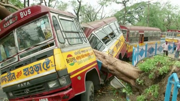 A bus damaged by a fallen tree due to Cyclone Amphan, is seen in Kolkata, West Bengal, India, May 21, 2020, in this still image from video. ANI via REUTERS TV ATTENTION EDITORS - THIS IMAGE HAS BEEN S ...