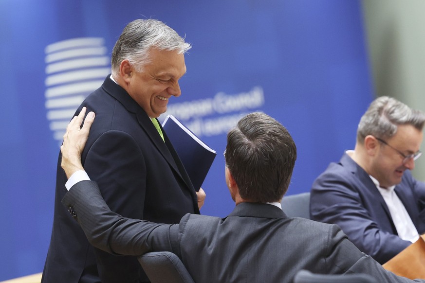 Hungary&#039;s Prime Minister Viktor Orban, left, speaks with Netherland&#039;s Prime Minister Mark Rutte during a round table meeting at the European Council building in Brussels, Friday, June 30, 20 ...