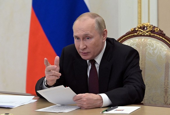 Russian President Vladimir Putin addresses heads of security and intelligence agencies of the Commonwealth of Independent States (CIS) member states via a video link in Moscow, Russia October 26, 2022 ...