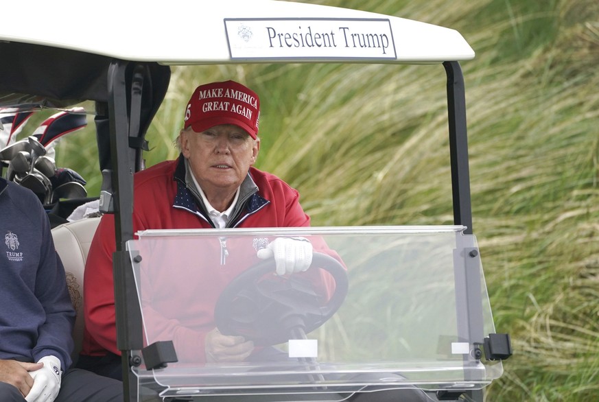Former US president Donald Trump plays golf at Trump International Golf Links &amp; Hotel in Doonbeg, Ireland, Thursday, May 4, 2023, during his visit to Ireland. (Brian Lawless/PA via AP)