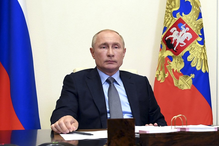 Russian President Vladimir Putin attends a meeting via video conference at the Novo-Ogaryovo residence outside Moscow, Russia, Friday, Aug. 14, 2020. (Alexei Nikolsky, Sputnik, Kremlin Pool Photo via  ...