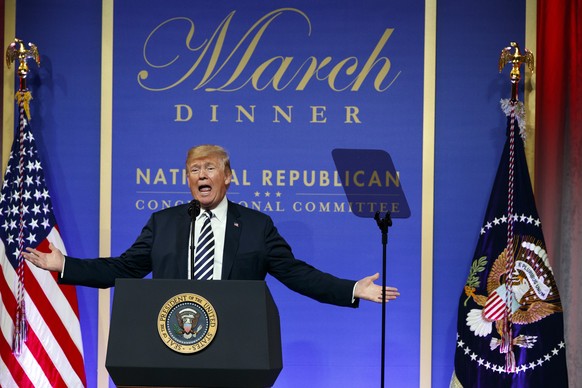 In this March 20, 2018 photo, President Donald Trump speaks to the National Republican Congressional Committee March Dinner at the National Building Museum in Washington. The tempest over President Do ...