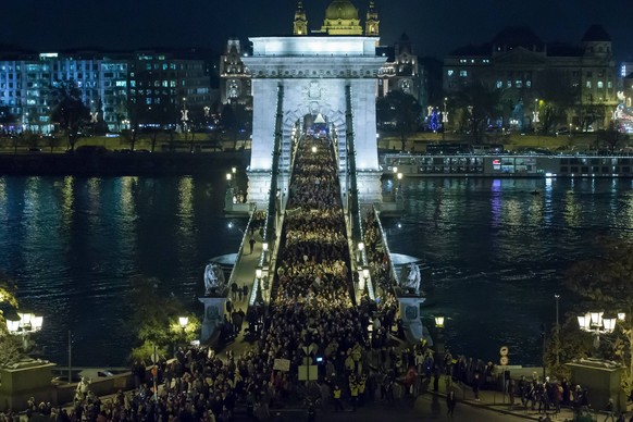 (141204) -- BUDAPEST, Dec. 4, 2014 -- People take part in a protest against corruption in Budapest, Hungary, on Dec. 4, 2014. The National Tax and Customs Administration of Hungary (NTCA) has been in ...