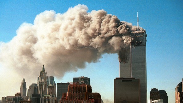 NEW YORK - SEPTEMBER 11, 2001: (SEPTEMBER 11 RETROSPECTIVE) Smoke pours from the twin towers of the World Trade Center after they were hit by two hijacked airliners in a terrorist attack September 11, ...