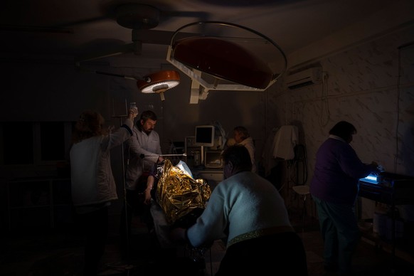 Doctors operate on 13-year-old Arthur Voblikova inside a hospital in Kherson, southern Ukraine, Tuesday, Nov. 22, 2022. Arthur Voblikova was injured after a Russian strike, and doctors had to amputate ...