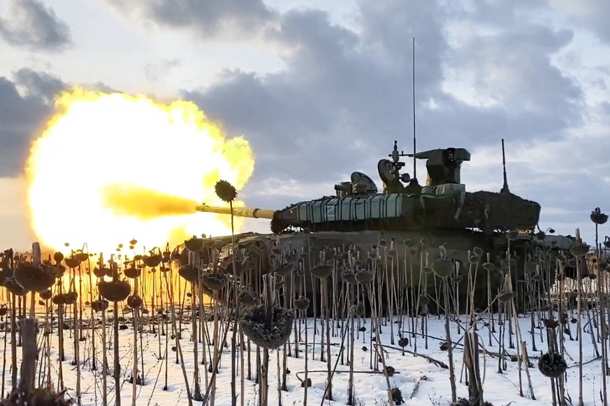 MARCH 7, 2023: This video screen grab shows servicemen of a Russian Western Military District troops tank crew fire during a combat mission in the zone of Russia s special military opertion. Russian A ...