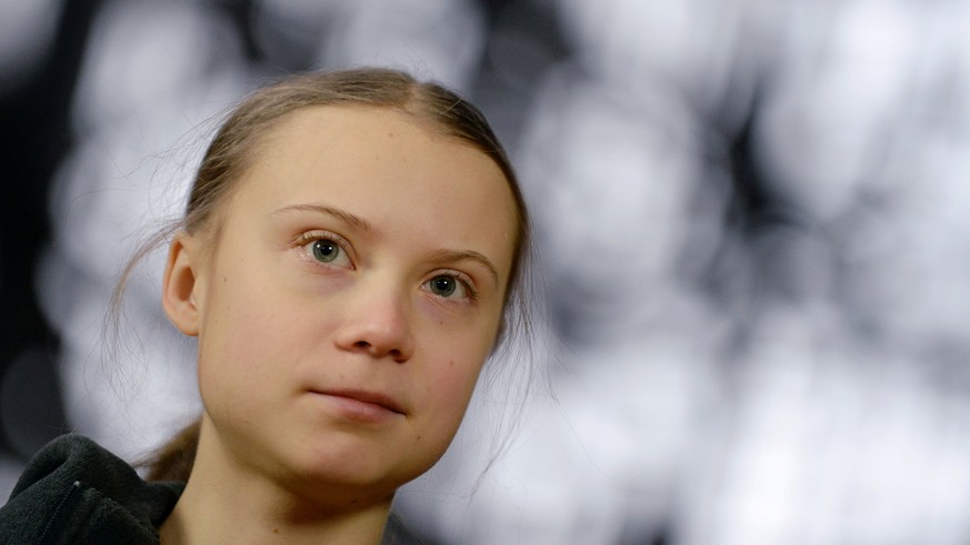 FILE PHOTO: Swedish climate activist Greta Thunberg talks to the media before meeting with EU environment ministers in Brussels, Belgium, March 5, 2020. REUTERS/Johanna Geron/File Photo