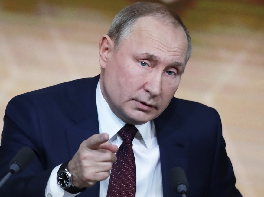 Russian President Vladimir Putin gestures during his annual news conference in Moscow, Russia, Thursday, Dec. 19, 2019. Putin says that global climate change poses new challenges to Russia. Speaking a ...