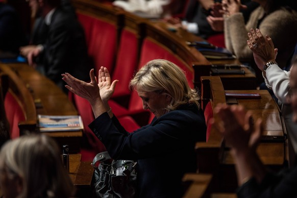 Question Time In The French Parliament Rassemblement National leader Marine Le Pen stands between the benches of the Assemblee Nationale in Paris, France, on November 12, 2024. Paris ILE-DE-FRANCE Fra ...