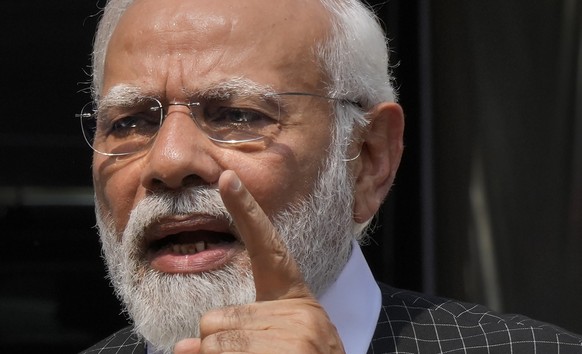 Indian Prime Minister Narendra Modi speaks as he arrives on the opening day of the monsoon session of the Indian parliament in New Delhi, India, Thursday, July 20, 2023. Modi Thursday broke more than  ...