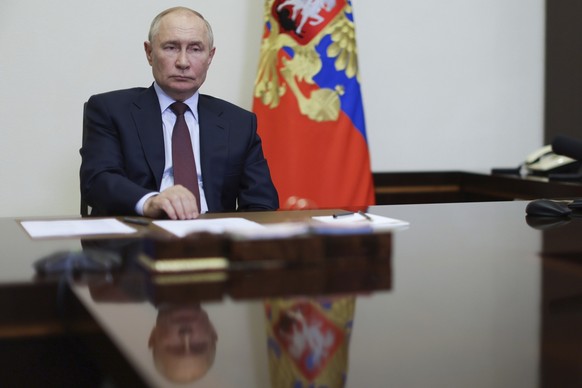 Russian President Vladimir Putin holds a meeting on economic issues via video conference at Novo-Ogaryovo state residence outside of Moscow, Russia, Monday, Aug. 26, 2024. (Alexander Kazakov, Sputnik, ...