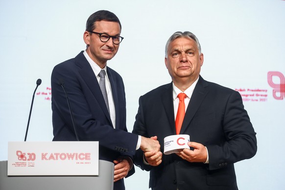 Polish Prime Minister Mateusz Morawiecki passes the v4 Presidency to Prime Minister of Hungary Viktor Orban during the Summit of Heads of Government of the Visegrad Group in Katowice, Poland on June 3 ...