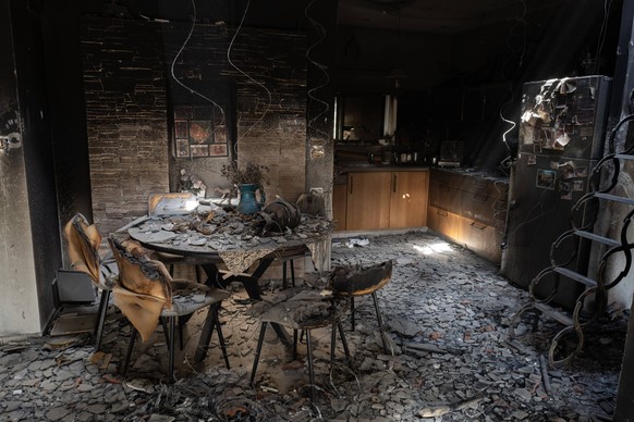 The interior of a kitchen and dinning room area in a civilian house in the Jewish community of Kibbutz Be eri along the border with the Gaza Strip during a press tour on October 20, 2023. This communi ...