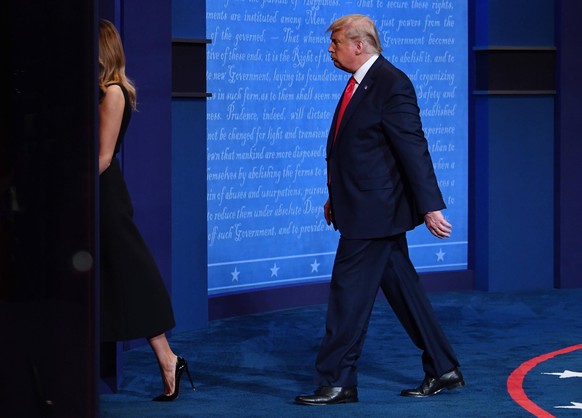 Republican presidential candidate President Donald Trump and first lady Melania Trump leave the stage after the final presidential debate with Democratic presidential candidate former Vice President J ...