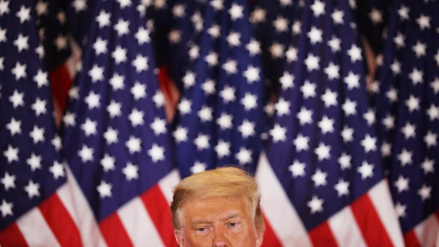 WASHINGTON, DC - NOVEMBER 04: U.S. President Donald Trump speaks on election night in the East Room of the White House in the early morning hours of November 04, 2020 in Washington, DC. Trump spoke sh ...