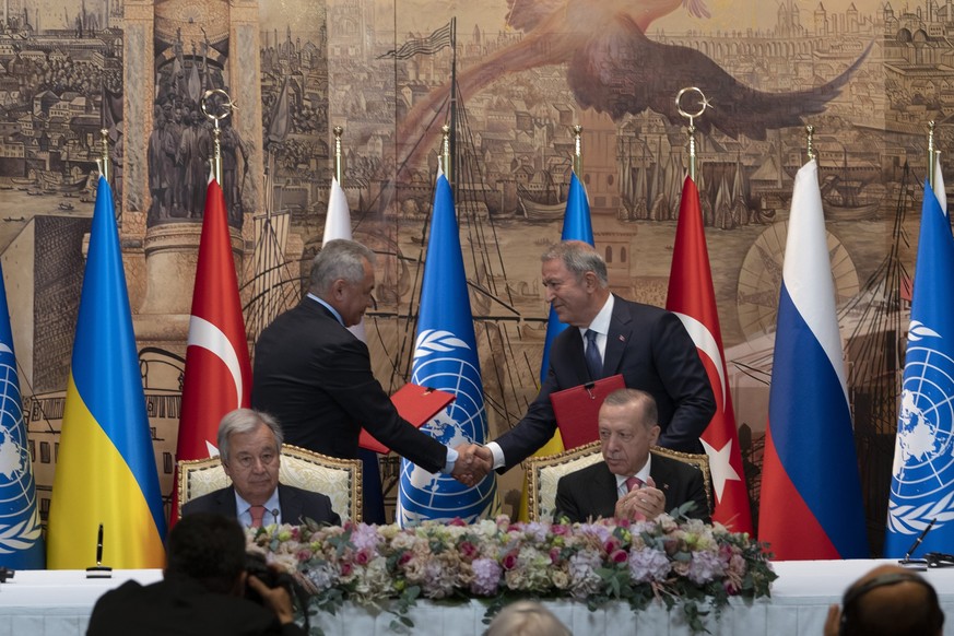 IDENTIFIES TWO PEOPLE SHAKING HANDS - Turkish President Recep Tayyip Erdogan, right, and U.N. Secretary General, Antonio Guterres, sit as Sergei Shoigu, Russia&#039;s Defense Minister, and Hulusi Akar ...