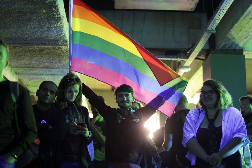 LGBT activists react during an event organised by the LGBT rights group "Mozaiq" in downtown Bucharest, Romania, October 7, 2018. Inquam Photos/Octav Ganea via REUTERS ATTENTION EDITORS - TH ...