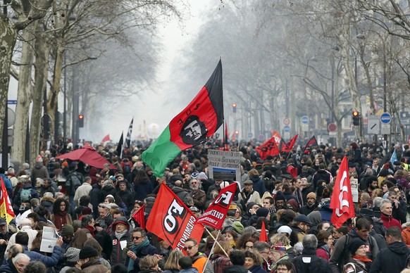 Demonstrators march in the streets of Paris, France, in support of railway workers, Thursday, March 22, 2018. Employees of the national railway company SNCF reject a government plan aimed at adapting ...