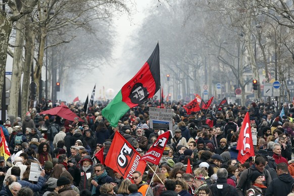 Demonstrators march in the streets of Paris, France, in support of railway workers, Thursday, March 22, 2018. Employees of the national railway company SNCF reject a government plan aimed at adapting  ...