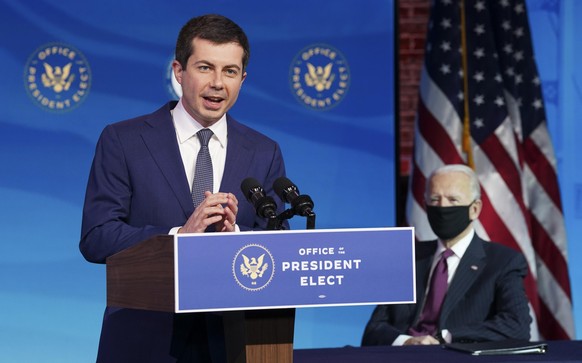 WILMINGTON, DELAWARE - DECEMBER 16: Former Democratic presidential candidate Pete Buttigieg speaks as U.S. President-elect Joe Biden (R) looks on after he was nominated to be Secretary of Transportati ...