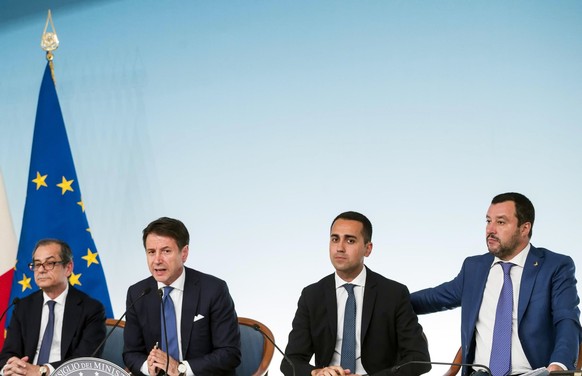 From left, Italian Minister of Economy and Finance, Giovanni Tria, Premier Giuseppe Conte, Deputy-Premiers Luigi Di Maio and Matteo Salvini attend a press conference at Chigi Palace Premier office in  ...