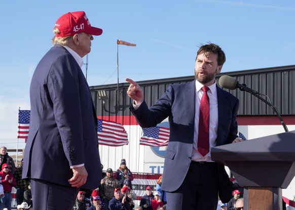 FILE - Sen. J.D. Vance, R-Ohio, right, points toward Republican presidential candidate former President Donald Trump at a campaign rally, March 16, 2024, in Vandalia, Ohio. Trump says Ohio Sen. JD Van ...