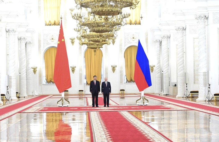 March 21, 2023, Moscow, Moscow Oblast, Russia: Russian President Vladimir Putin welcomes Chinese President Xi Jinping, left, for the official State arrival ceremony before meeting at the Kremlin Palac ...