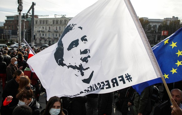 TBILISI, GEORGIA NOVEMBER 15, 2021: Supporters of former Georgian president Mikheil Saakashvili rally in Tbilisi demanding that Saakashvili be transferred from a prison hospital to a civil one. Recent ...