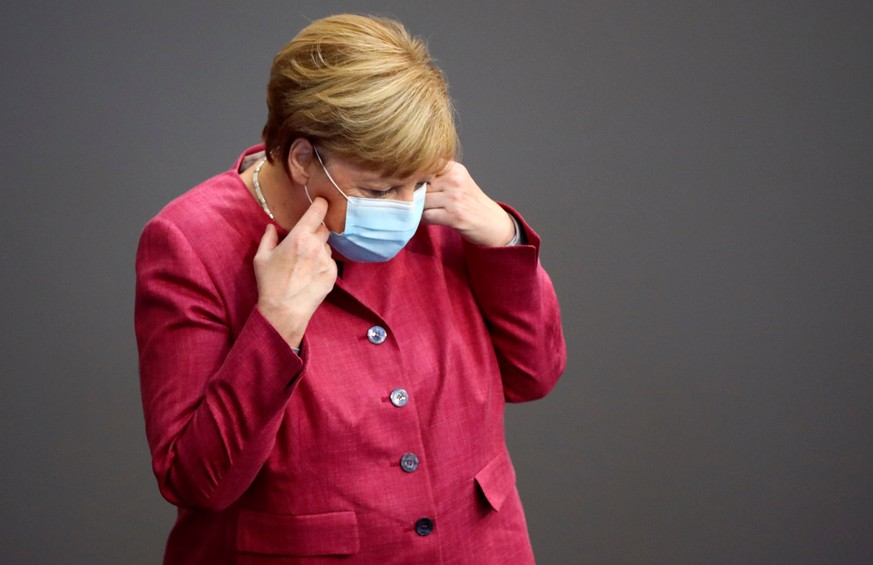 German Chancellor Angela Merkel wearing a face mask attends a session of the German lower house of parliament Bundestag, in Berlin, Germany, September 30, 2020. REUTERS/Hannibal Hanschke