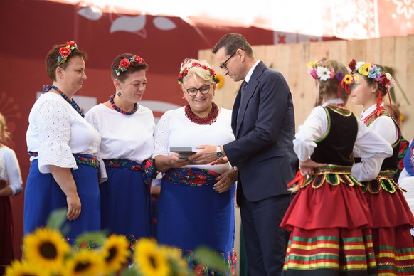 Grateful to the Polish Countryside Rally in Poland. Polish PM Mateusz Morawiecki awards housewifes during the annual farmers thanksgiving rally in Mietne, Poland on September 16, 2023. Organised by Po ...