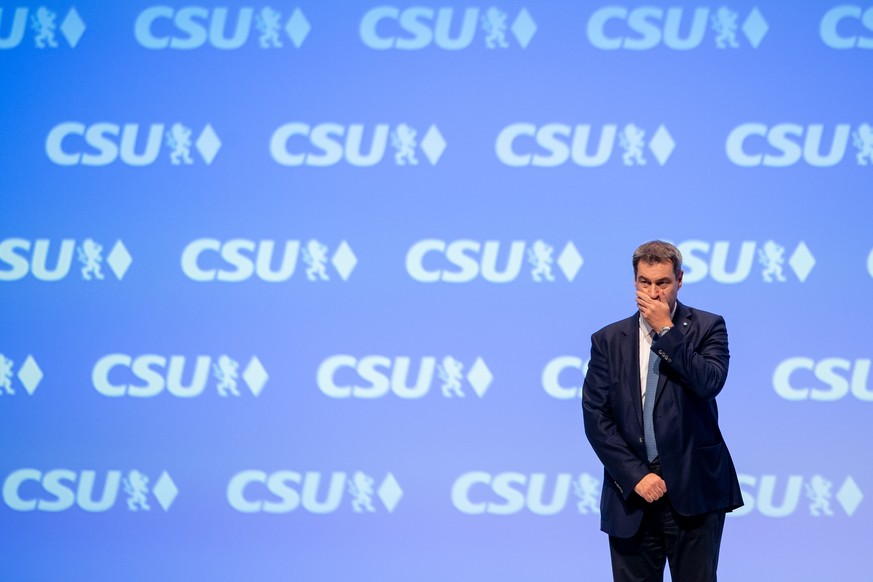 MUNICH, GERMANY - OCTOBER 18: Markus Soeder, leader of the Christian Social Union (CSU), the Bavarian party of Germany&#039;s Christian Democrats, stands on the podium after his speech on the first da ...