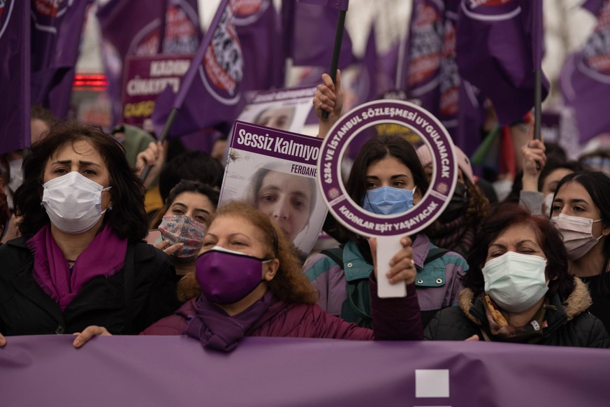 Women hold placards and shot slogans during a protest against Turkey s withdrawal decision from the Istanbul Convention, in Istanbul, Turkey, 20 March 2021. Turkey has withdrawn from an international  ...