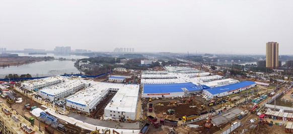 The Huoshenshan temporary field hospital under construction is seen as it nears completion in Wuhan in central China's Hubei Province, Sunday, Feb. 2, 2020. The Philippines on Sunday reported the firs ...