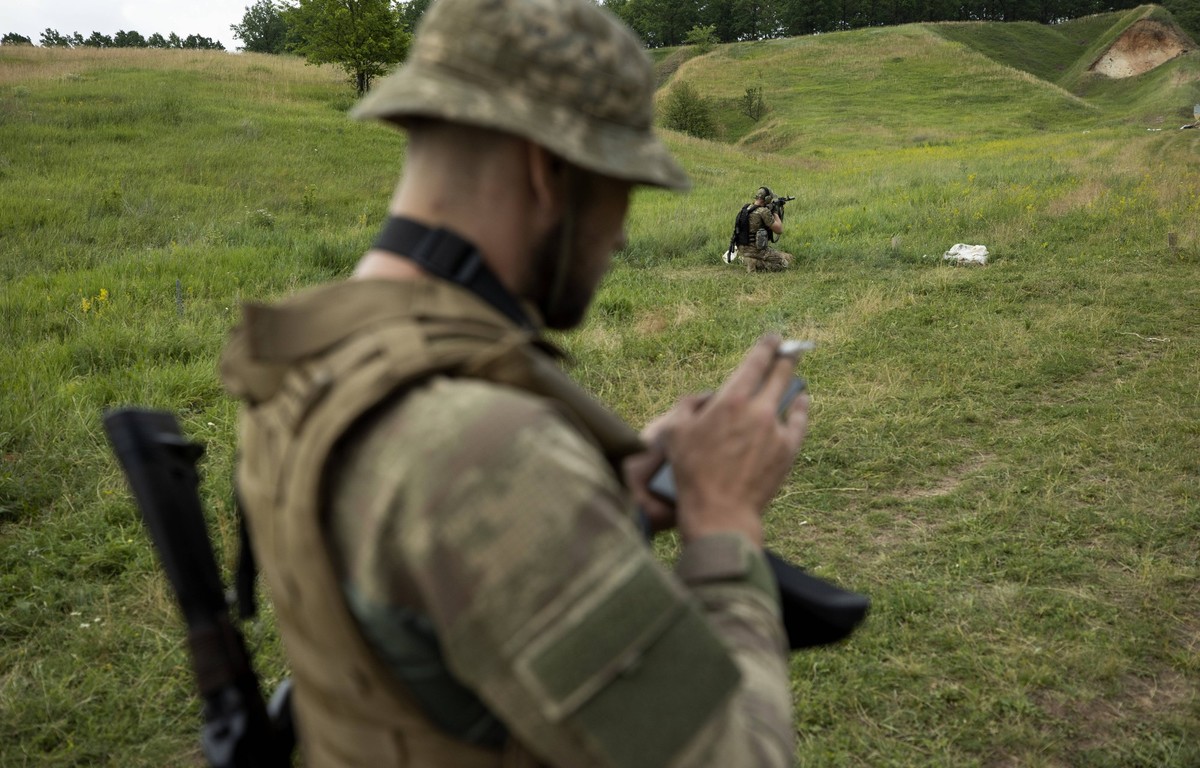 Photograph dated June 23, 2022 showing Azov Army fighters during training, outside Kharkiv, Ukraine issued 24 June 2022. For the Ukrainians they are national heroes, for the Russians a neo-Nazi militi ...
