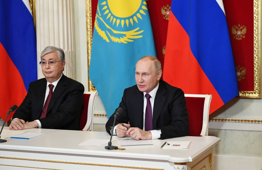Russia Kazakhstan 8325758 28.11.2022 Russia s President Vladimir Putin and Kazakhstan s President Kassym-Jomart Tokayev, left, address the participants of the plenary session of the 18th Russia-Kazakh ...