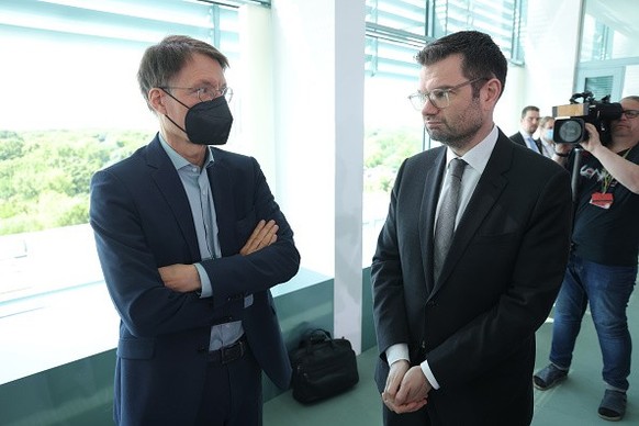 BERLIN, GERMANY - JUNE 15: German Federal Health Minister Karl Lauterbach (L) chats with Justice Minister Marco Buschmann prior to the weekly federal government cabinet meeting on June 15, 2022 in Ber ...