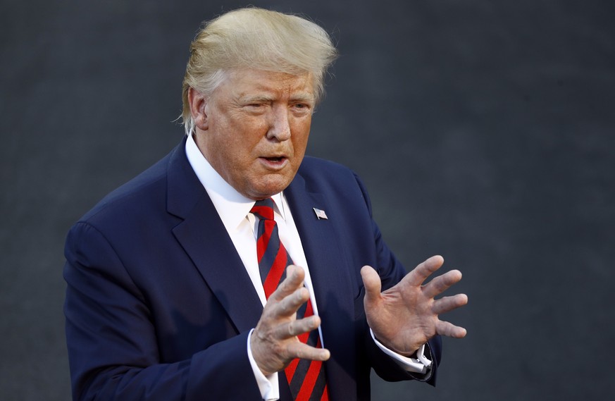 President Donald Trump speaks with reporters before departing on Marine One from the South Lawn of the White House, Thursday, Sept. 12, 2019, in Washington. Trump is en route to Baltimore. (AP Photo/P ...