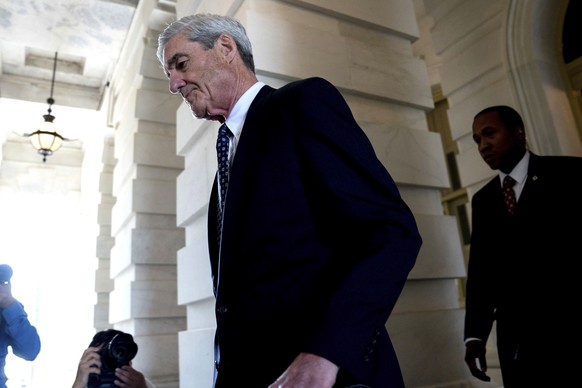 FILE - In this June 21, 2017, file photo, former FBI Director Robert Mueller, the special counsel probing Russian interference in the 2016 election, departs Capitol Hill following a closed door meetin ...