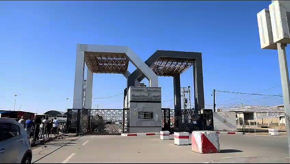 People, including those who possess foreign passports, wait at the Rafah Crossing, with the hope of crossing into Egypt on Monday, October 16, 2023. Following the commencement of the conflict bitween  ...