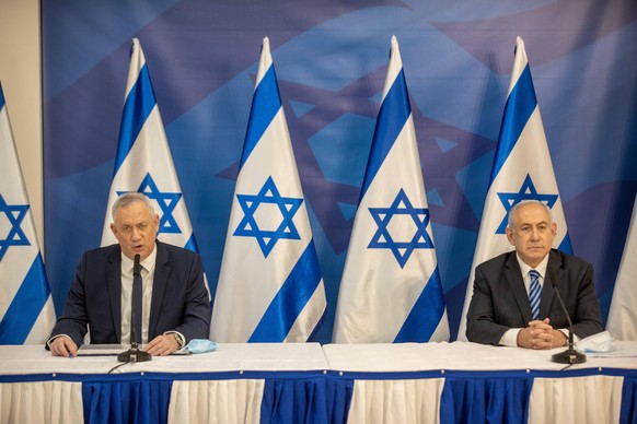 Israeli Prime Minister Benjamin Netanyahu R and Alternate PM and Defence Minister Benny Gantz L, issue a statement, at the Israeli Defense Ministry in Tel Aviv, Israel, on Monday July 27, 2020, follow ...