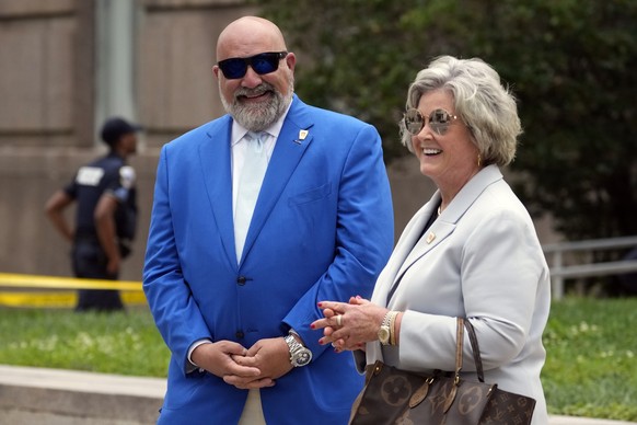 Senior strategist&#039;s for former President Donald Trump, Chris LaCivita and Susie Wiles stand outside after Trump arrived at the E. Barrett Prettyman U.S. Federal Courthouse, Thursday, Aug. 3, 2023 ...