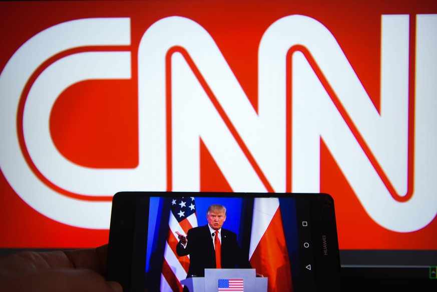 July 26, 2018 - Krakow, Poland - A mobile phone shows President of United States of America, Donald Trump with CNN logo on the background. Krakow Poland PUBLICATIONxINxGERxSUIxAUTxONLY - ZUMAs197 2018 ...