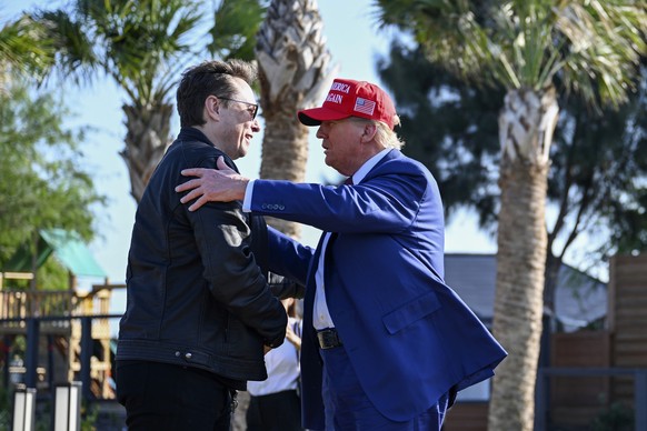 President-elect Donald Trump greets Elon Musk before the launch of the sixth test flight of the SpaceX Starship rocket Tuesday, Nov. 19, 2024 in Boca Chica, Texas. (Brandon Bell/Pool via AP)