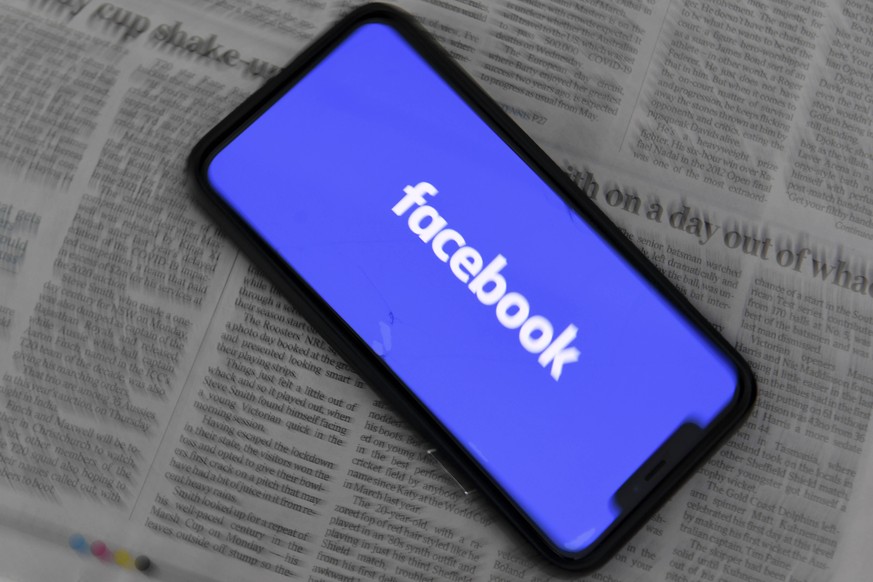 FACEBOOK AUSTRALIAN MEDIA BLOCKAGE, An illustration image shows a phone screen with the Facebook logo seen at Parliament House in Canberra, Thursday, February 18, 2021. Social media giant Facebook has ...