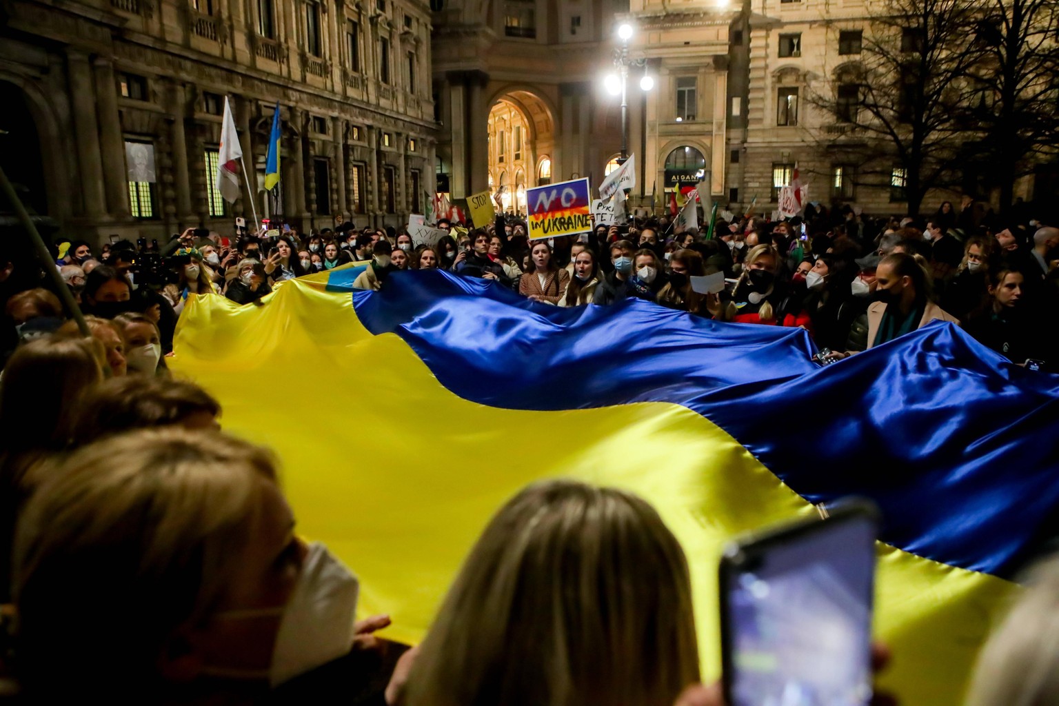 February 24, 2022, Milan, Italy: Rally to demonstrate against the Russian military invasion of Ukraine on February 24, 2022 in Milan, Italy. Russia launched a full-scale invasion of Ukraine this morni ...