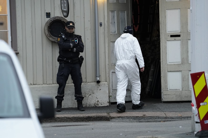 Police work near a site after a man killed several people, in Kongsberg, Norway, Thursday, Oct. 14, 2021. Police in Norway are holding a 37-year-old man from Denmark suspected in a bow-and-arrow attac ...