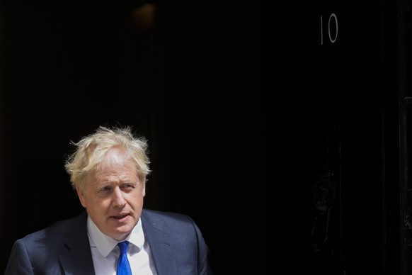 British Prime Minister Boris Johnson leaves 10 Downing Street in London, Wednesday, July 6, 2022. A defiant British Prime Minister Boris Johnson is battling to stay in power after his government was r ...