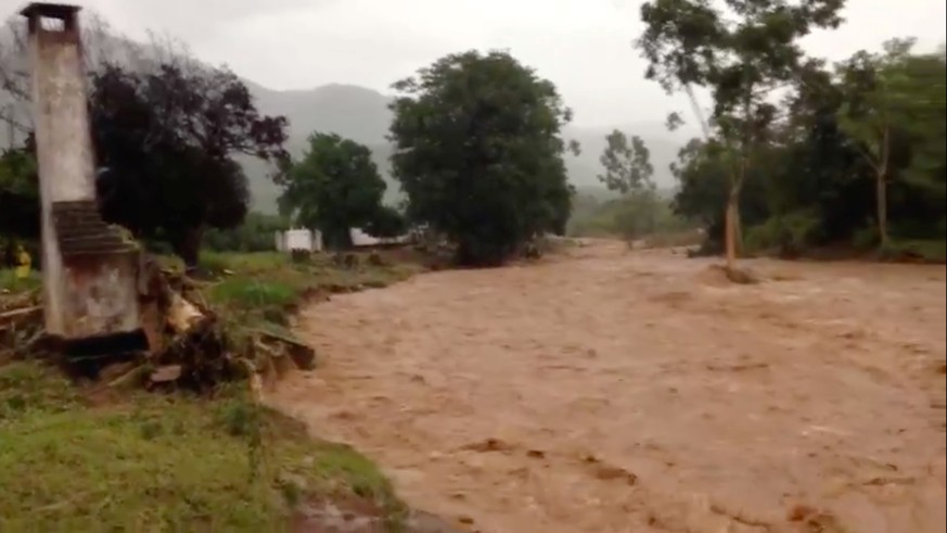 Flooding caused by Cyclone Idai is seen in Chipinge, Zimbabwe, March 16, 2019 in this still image taken from social media video obtained March 17, 2019. Tony Saywood via REUTERS ATTENTION EDITORS - TH ...
